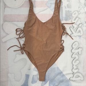 Tan One Piece Swimsuit with Minimalist Design
